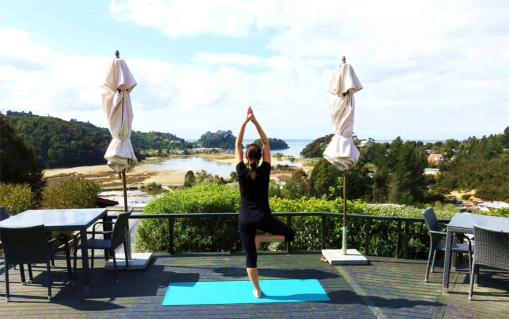 Yoga on the deck at Kimi Ora Retreat, Kaiteretere